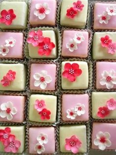 there are many square cakes decorated with flowers