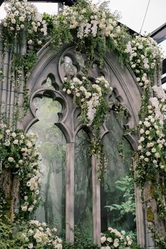 Enchanting wedding arch adorned with cascading white flowers and lush greenery, creating a romantic and magical backdrop for a wedding ceremony All White Floral Wedding, White Floral Wedding Arch, Floral Wedding Arch, Wedding Theme Color Schemes, Wedding Artwork, White Floral Wedding, Cascading Flowers, Romantic Backdrop, Gothic Garden