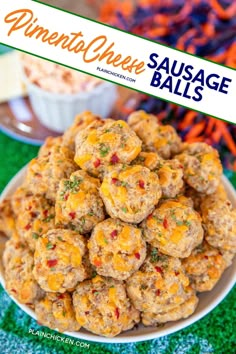 a plate full of sausage balls on top of a green tablecloth with carrots in the background