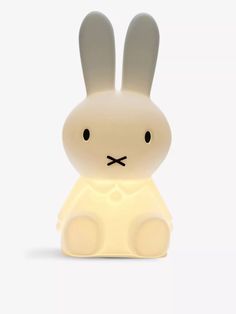 a white rabbit lamp sitting on top of a table