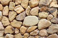 a stone wall made up of small rocks