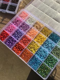 there are many different colors of beads in the box and one is filled with them