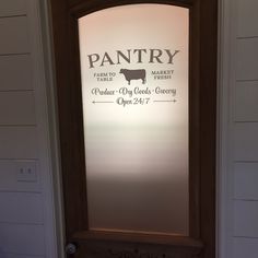 a door with a sign that says pantry on it and a cow in the background