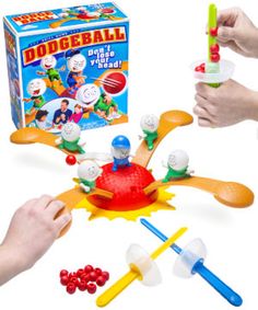 two hands are playing with toys in front of a box