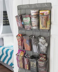 a wall hanging organizer filled with lots of items