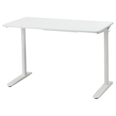 a white computer desk sitting on top of a table