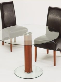 a glass table with two chairs around it