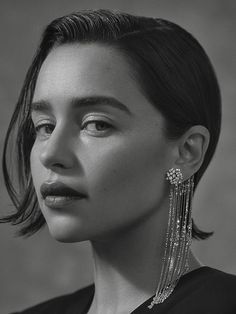 black and white photograph of a woman wearing earrings