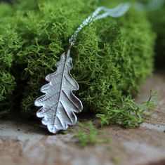 Silver oak leaf necklace with sterling silver chain - great gift idea for a plant lover. Strength and Durability talisman This  unique quercus plant pendant was created on the basis of a natural oak leaf. It is made of a good quality brass covered with pure silver. The set includes a 925 silver chain. You can choose the length of the chain. Available lengths: S: 40 cm - 15.75 inches  M: 50 cm - 19.69 inches L: 70 cm - 27.56 inches Each of them has a 5 cm (1.97 inches) extension.  The pendant is 3,8 cm (1.5 inches) long. A true masterpiece of nature-inspired jewelry. Handcrafted with precision and inspired by the beauty of plants, this necklace showcase the intricate details of a real oak leaf, capturing its organic charm. Perfect as botanical beauty gifts for her, these artistic jewelry co Nature-inspired Engraved Sterling Silver Necklace, Silver Leaf-shaped Nature-inspired Necklace, Handmade Sterling Silver Leaf Necklace, Handmade Sterling Silver Leaf-shaped Necklace, Nature-inspired Leaf Shaped Sterling Silver Necklace, Nature-inspired Sterling Silver Leaf Necklace, Nature-inspired Leaf Shape Sterling Silver Jewelry, Handmade Sterling Silver Botanical Necklace, Sterling Silver Leaf Necklace