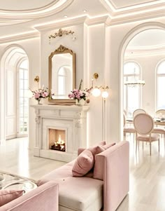 a living room filled with furniture and a fire place in the middle of a room