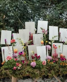 a table topped with lots of cards and flowers