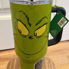 the grin face is drawn on this green cup, and it's ready to be used