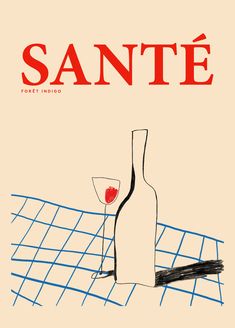 a wine glass and bottle sitting on top of a tennis court with the word sante in red