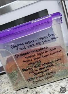 a container with some food inside of it on a counter top next to a microwave