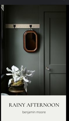 a room with green walls and white flowers