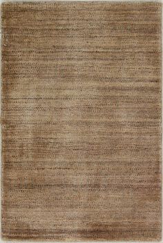 an area rug with brown and tan colors