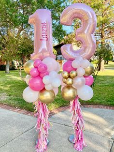 pink and gold balloons with the number thirteen on them