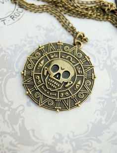 a necklace with a skull and cross on it