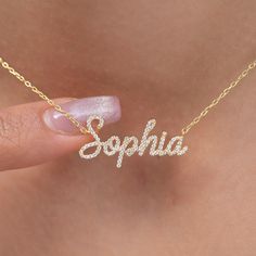 "This 14k personalized diamond name necklace is the perfect gift for the bridal party, someone special, or yourself.  How to order 1- Pick the fonts you like and send us a message 2- We will send you a picture of your name with the fonts you chose 3- If you like it any of them, place your order. 4- We send a final 3d mock up for approval. 5- Once approved we go ahead and finish your necklace. M A T E R I A L & L E N G T H Available in 14k Yellow Gold, 14k Rose Gold, 14k White Gold, Sterling Silver Stone: Natural Diamond Thickness: 1.2mm / 0.05\" Initials Lowercase: 4.5-5.5 mm Capital: 9-11 mm Diamond: 0.15 ct. - 0.60 ct. depending on the name Chain Length:  14+2, 16+2, 18+2 options or any length up to 20 inches without extension. (Please leave a note for the chain length) Color: G  Quality Personalized Cubic Zirconia Necklaces For Anniversary, Personalized Diamond Necklace For Birthday, Personalized Name Necklace, Personalized Cubic Zirconia Necklaces, Personalized Cubic Zirconia Necklace For Special Gifts, White Gold Diamond Name Necklace Gift, Personalized Initial Pendant Name Necklace For Anniversary, White Gold Name Necklace With Cubic Zirconia For Gift, White Gold Nameplate Necklace For Anniversary