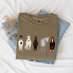 This horse shirt is the perfect gift for a friend who loves horses and of course yourself! These t-shirts are Comfort Colors® brand , relaxed fit. Please use the measurements chart in the pictures section to determine your correct size. Please Size up for an oversized look. -Lay your favorite shirt at home flat and measure armpit to armpit to compare to the size chart in the photos -Care Instructions: Wash inside out in cold water, gentle cycle, tumble or line dry. Do not iron on design. https://www.etsy.com/shop/ModishChicBoutique?ref=seller-platform-mcnav -If you have any questions, please contact me and I will be happy to answer. -Please note that due to lighting effects, monitor's brightness, contrast and other settings, there might be some slight differences in the color tone/shade of Funny Farm Animals, Horse Shirts, Baby Announcement Shirts, Embroidered Horse, Measurements Chart, Funny Farm, Horse Shirt, Family Vacation Shirts, Horse Owner