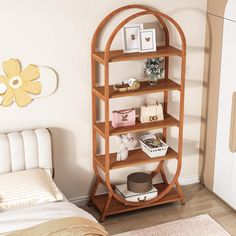 a bed room with a neatly made bed and a book shelf