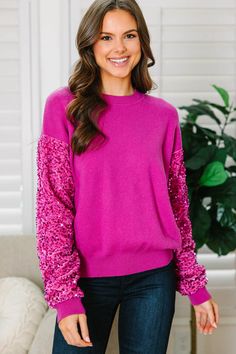 If you like this sweater then don't think twice about getting it! Because this one is going to go fast! Those velvet sleeves with all of those shimmering sequins are fabulous! The fabric is luxurious and we love pop of glam! This cozy sweater is just what you need for the winter and spring season! This sweater features a round neckline and long sleeves that have a velvet fabric with sequins. Material has a generous amount of stretch.Sydney is wearing the small. Cheap Pink Holiday Tops, Luxury Sequined Tops For Winter, Festive Long Sleeve Sweater, Jewel Colored Sweater, Asymmetrical Sweater Sequin Strap, Hot Pink Sweater To The Office, Christmas Sweaters Glitter, Sparkly Holiday Sweater, Glitter Sweater