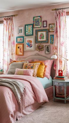 a bedroom decorated in pink and yellow with pictures on the wall above the headboard