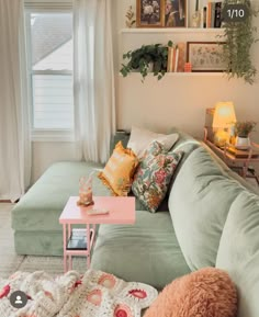 a living room filled with lots of furniture and decor