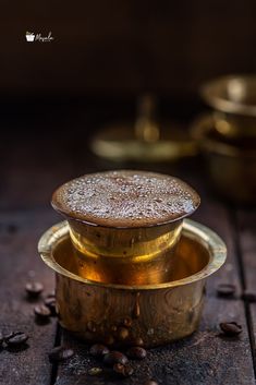 an image of some food that is in the middle of coffee beans on a table