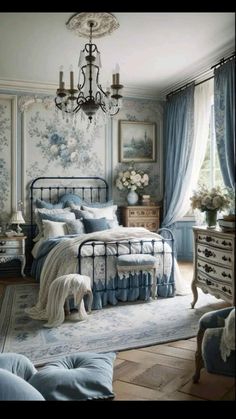 a bed room with a neatly made bed and a chandelier