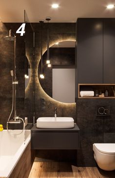 a modern bathroom with wood paneling and white sink, toilet and bathtub in the center