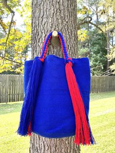 These beautiful, one-of-a-kind, 100% handmade top handle bag has been carefully crocheted by women from the Wayuu tribe in La Guajira, Colombia.This beautiful Wayuu braided bag is carefully crafted using a double thread technique for the body. Approximate dimensions:Height: 11-12 inchesWidth: 13 inchesDepth: 4 inchesEach piece represents approximately 1 week of work for a single artisan.**Listing is for 1 Wayuu bag only.**Please choose color in the drop down options. Handmade Top Handle Bucket Bag, Blue Handwoven Bag As A Gift, Large Handmade Shoulder Bag For Shopping, Large Handmade Shoulder Bag For Everyday, Large Everyday Handmade Bags, Large Handmade Everyday Bags, Large Handmade Bags, Large Handmade Everyday Shoulder Bag, Blue Crochet Bag With Top Handle For Everyday Use