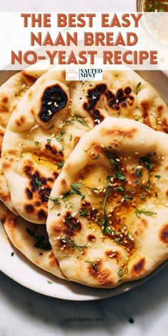 the best easy naan bread no - yeast recipe on a white plate with text overlay