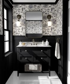 a black and white bathroom with floral wallpaper on the walls, two sinks and a large mirror