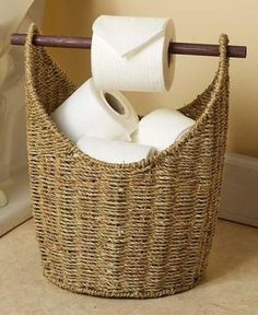 two rolls of toilet paper are in a basket