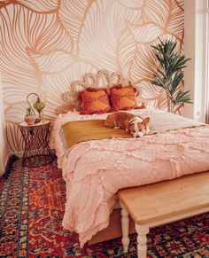 a dog laying on top of a bed in a bedroom