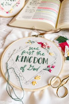 a cross - stitch pattern with the words peace trust the kingdom on it next to scissors and an open book