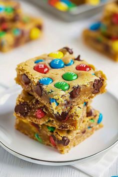 two pieces of cookie bars stacked on top of each other with m & m candies