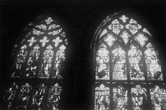 two large stained glass windows in a building