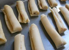 some food is laying out on a baking sheet and ready to be cooked in the oven