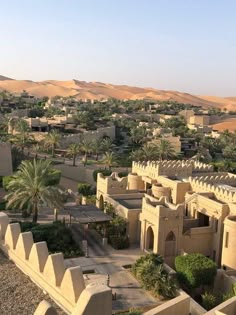 an aerial view of a desert city with palm trees