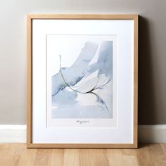 a watercolor painting of a branch in blue and white