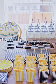 an assortment of cupcakes on display at a party