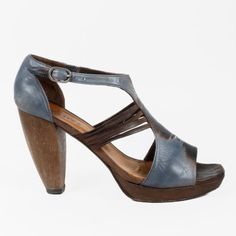 Crafted From Leather, These Coclico Sandals Feature An Abstract Blue Upper With Cut-Outs On The Sides, A Square Toe, An Adjustable Ankle Strap, And A Sculptural Wooden Heel. Size: 39 Condition: Fair; Visible Wear On Outsole, Visible Residue On The Insole, No Inclusions Approximate Measurements: Insole Length: 10” (25 Cm) Heel Height: 4” (10 Cm) Composition: Leather, Wood Blue High Heel Sandals With Leather Sole, Blue Ankle Strap Sandals With Leather Sole, Blue Leather Sandals With Reinforced Heel, Blue Ankle Strap Heels With Wooden Heel, Blue Leather Heels With Wooden Heel, Blue Sandals With Wooden Open Heel, Blue Leather Sandals With Wooden Heel, Chic Blue Sandals With Leather Sole, Blue Open Heel With Leather Sole