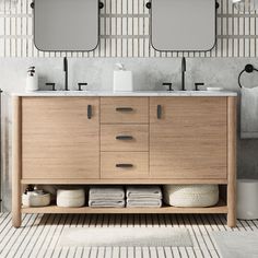 a bathroom vanity with two mirrors above it