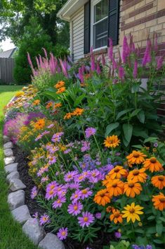 a flower garden in front of a house