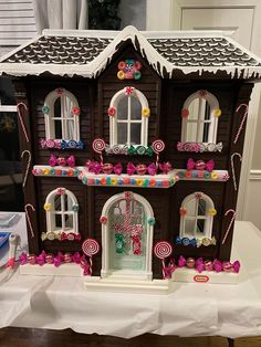 a gingerbread house decorated with candy and candies