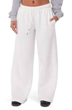 Let 'em know you're here for the drama in cotton-blend sweatpants fashioned with a low rise and wide leg. 50% cotton, 50% polyester Machine wash, line dry Imported White Straight Leg Sweatpants Outfit, White Straight Leg Pants, Sweatpants No Cuff, White Bottoms, Clean Girl Pants, White Wide Leg Loungewear Sweatpants, Baggy White Sweatpants, White Relaxed Fit Wide Leg Sweatpants, White Wide-leg Sweatpants