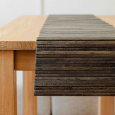 a stack of wooden boards sitting on top of a table