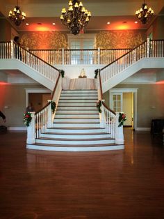 the stairs are decorated with flowers and greenery